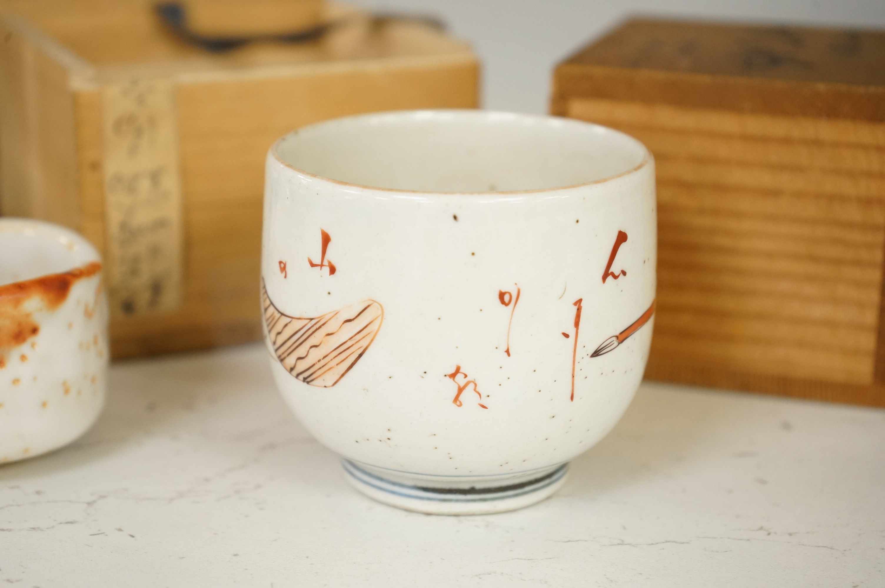 Two Japanese Mino ware sake cups, boxed, largest 7cm tall